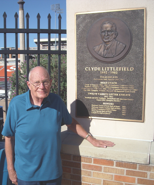 Littlefield stands in front of a dedication plaque for his father Coach Littlefield. Photo: Nick Roland