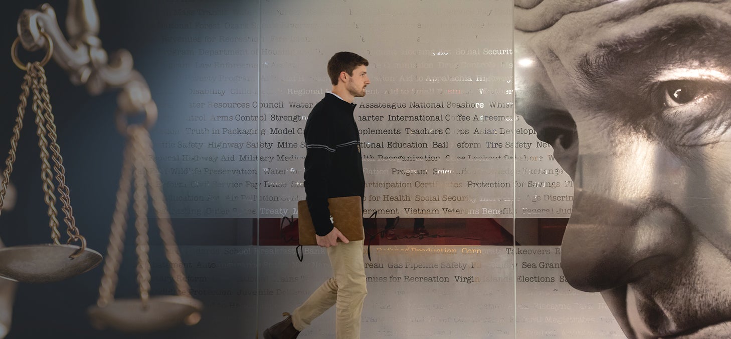 Student walking through exhibit.