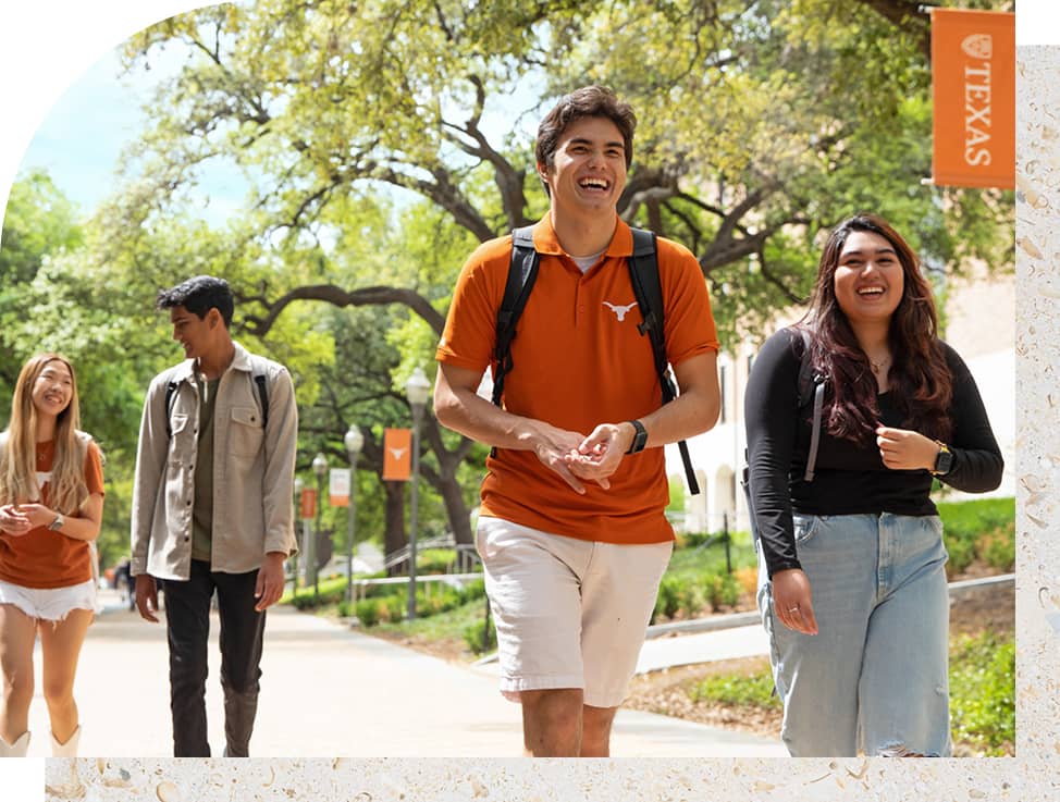 Four UT students walking around campus