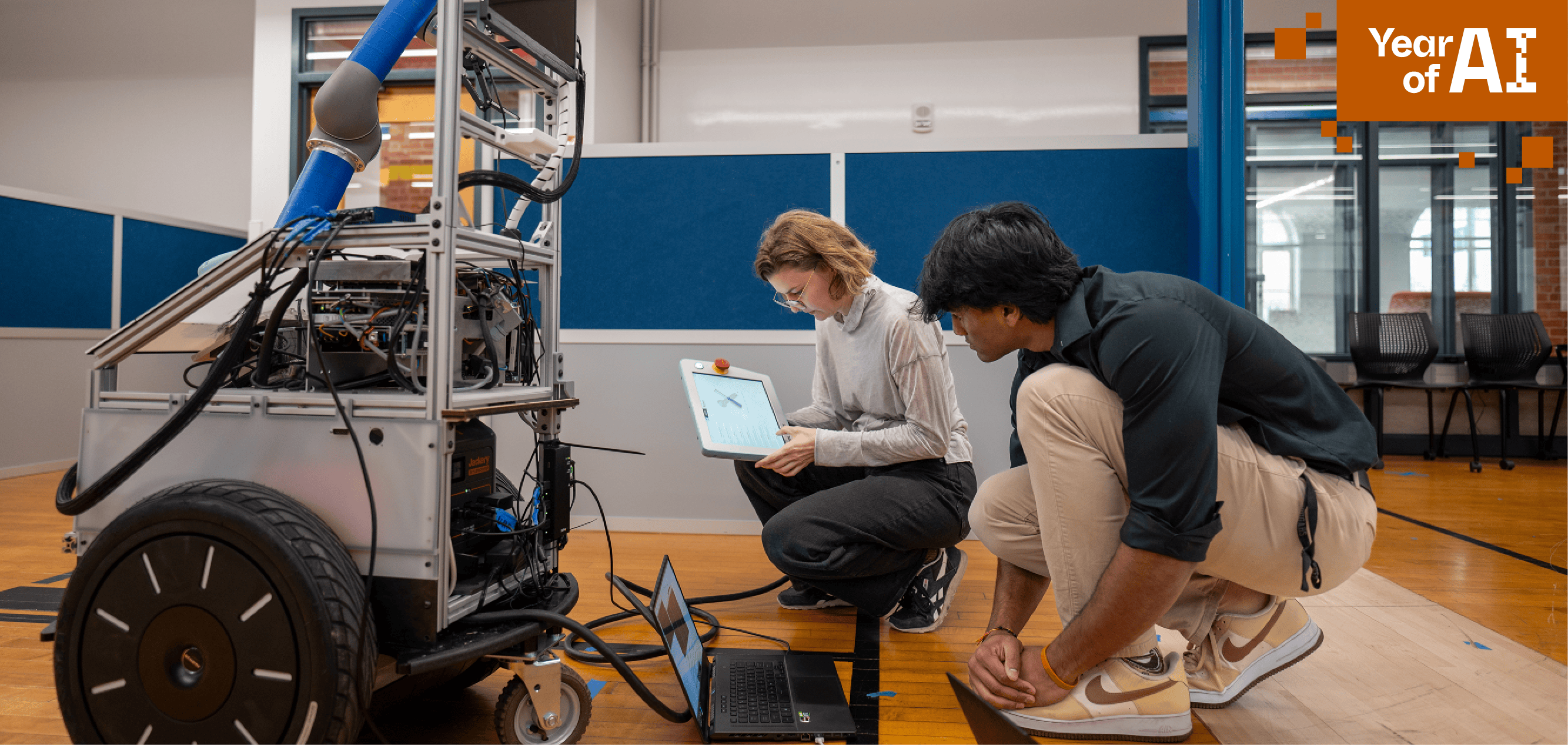 Two students working on a robot