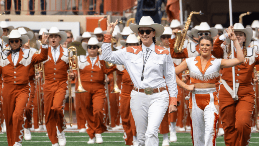 Longhorn Band members marching on the field