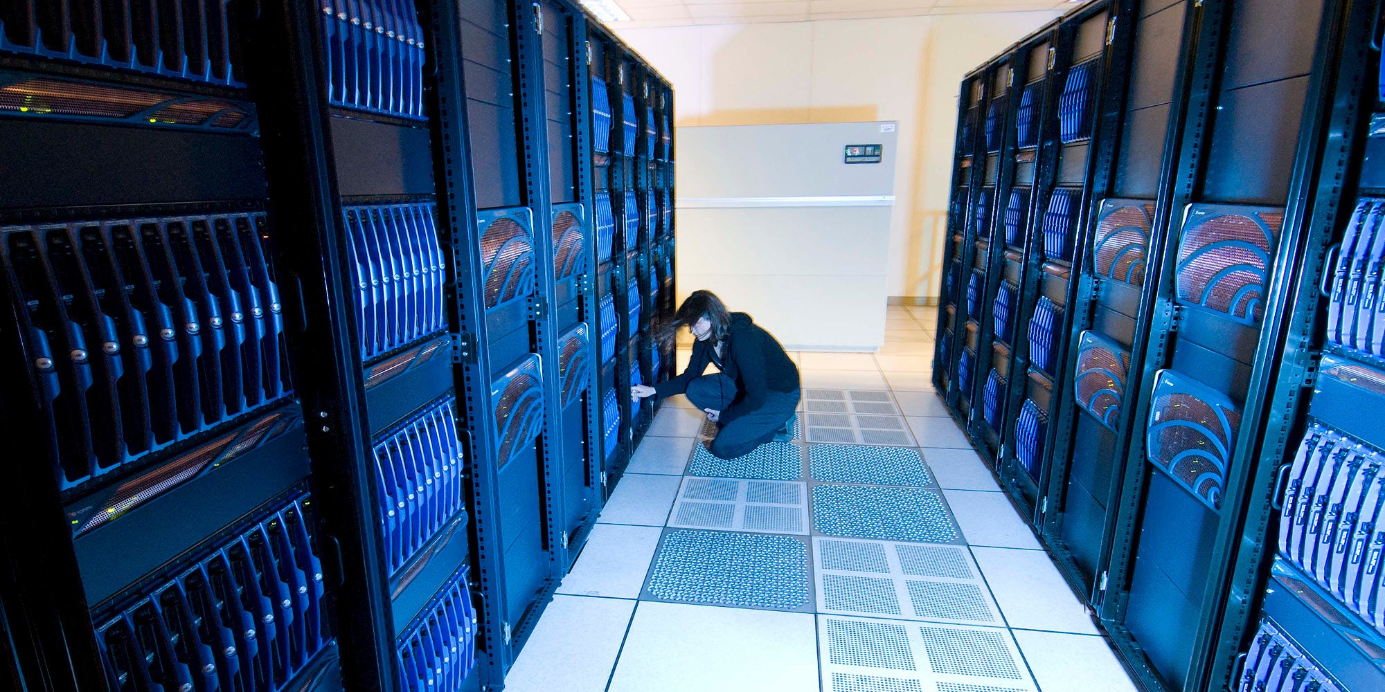 Person working in a server room.