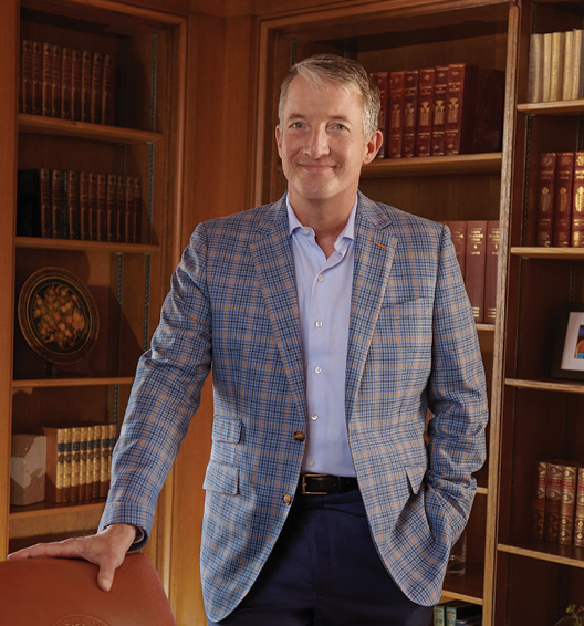 President Jay Hartzell standing in front of bookcases.