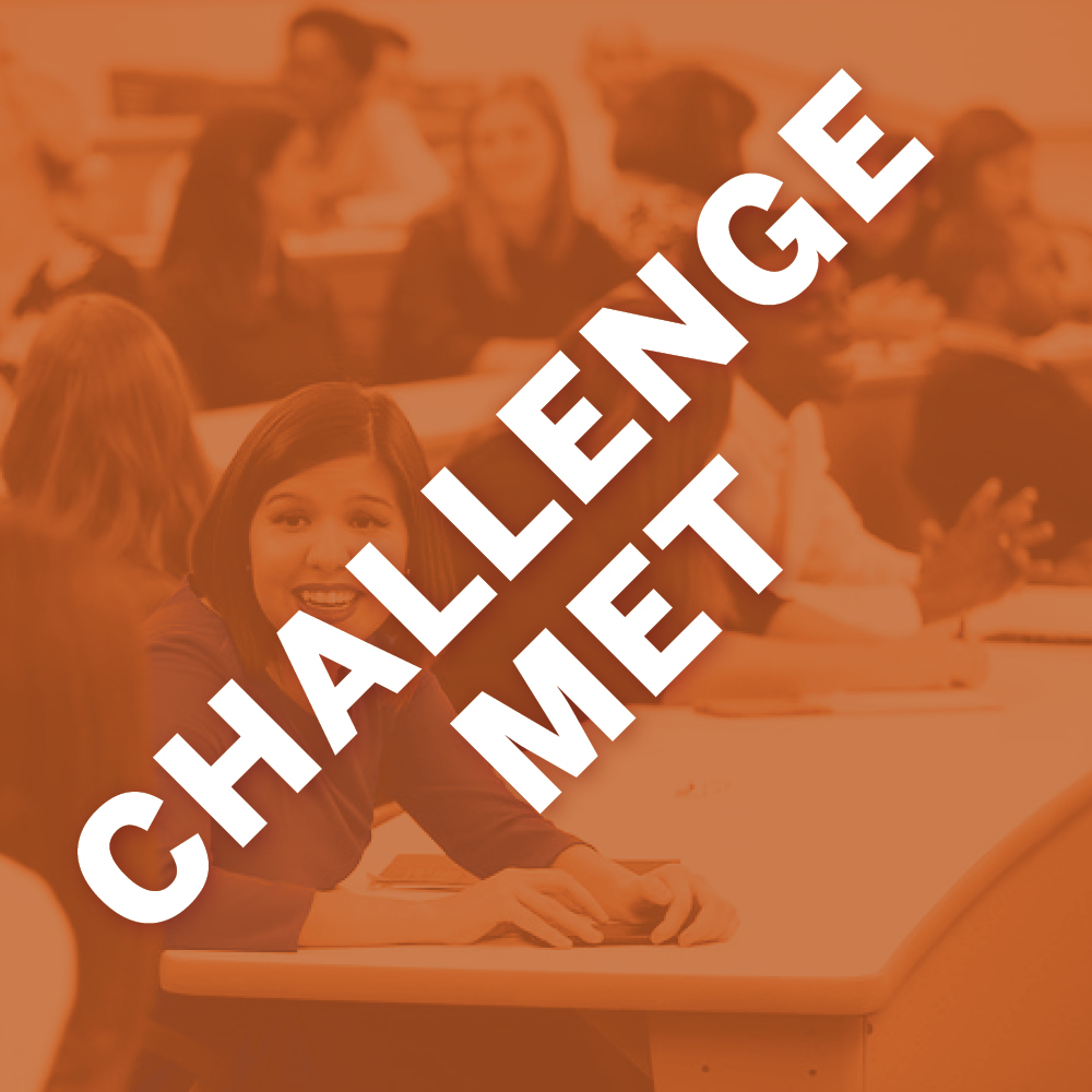 Image of LBJ students in a classroom. The graphic has a burnt orange overlay with white text stating "Challenge Met."